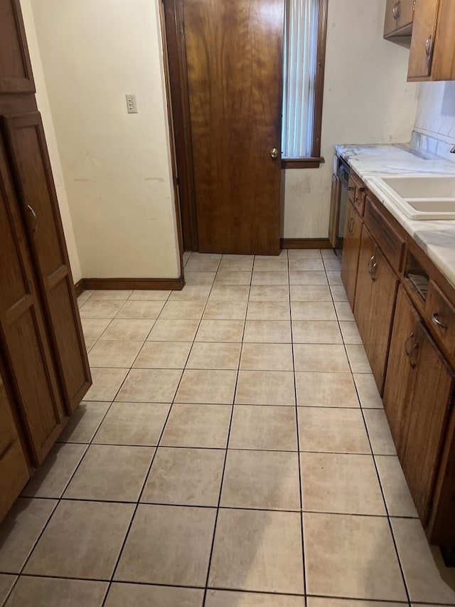 1513 E 86th Pl, Chicago, IL 60619 - kitchen featuring light tile patterned floors and light countertops