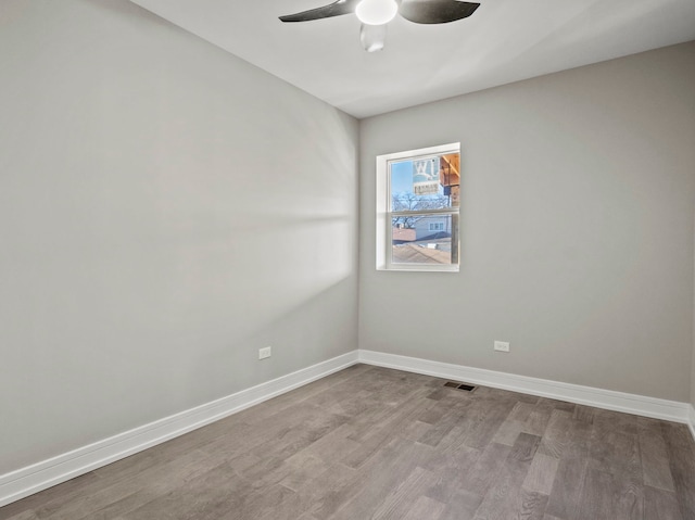 7711 S Ridgeland Ave, Chicago, IL 60649 - spare room featuring a ceiling fan and wood finished floors