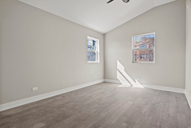 7711 S Ridgeland Ave, Chicago, IL 60649 - unfurnished room featuring healthy amount of natural light, ceiling fan, lofted ceiling, and wood finished floors