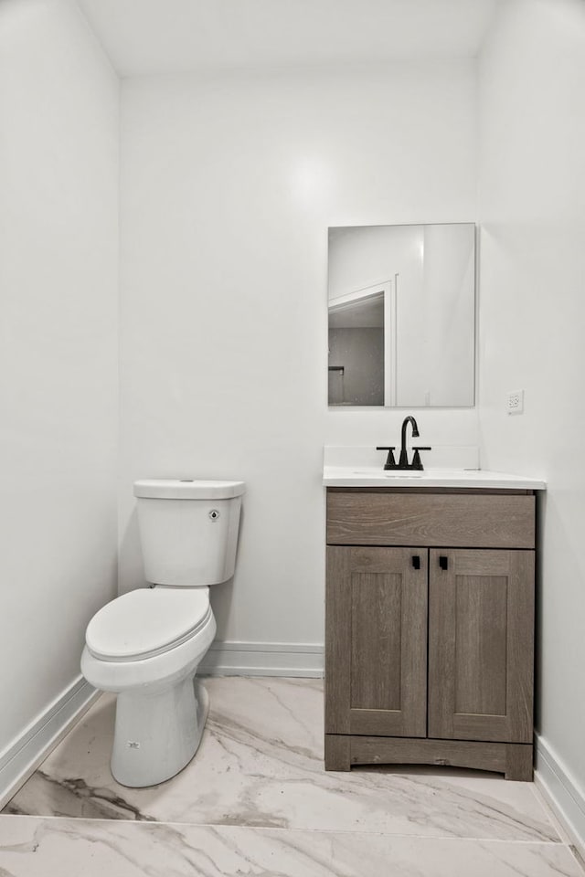 7711 S Ridgeland Ave, Chicago, IL 60649 - half bathroom featuring marble look tiles and vanity
