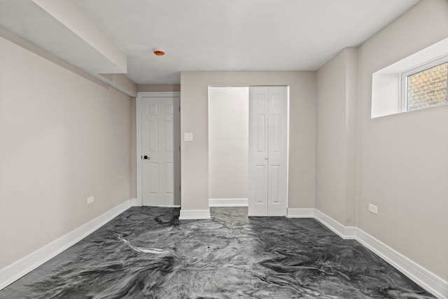 7711 S Ridgeland Ave, Chicago, IL 60649 - unfurnished bedroom with baseboards and a closet