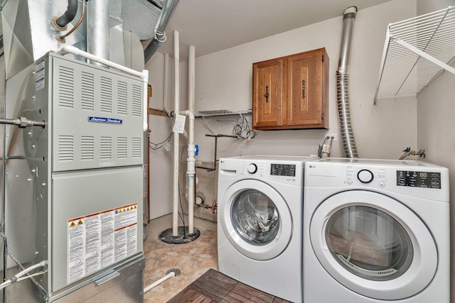 16636 Winding Creek Rd, Plainfield, IL 60586 - laundry room featuring washer and clothes dryer, heating unit, and cabinet space