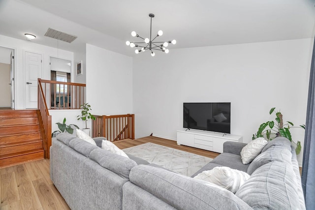 16636 Winding Creek Rd, Plainfield, IL 60586 - living area with light wood-style flooring, a chandelier, and stairway