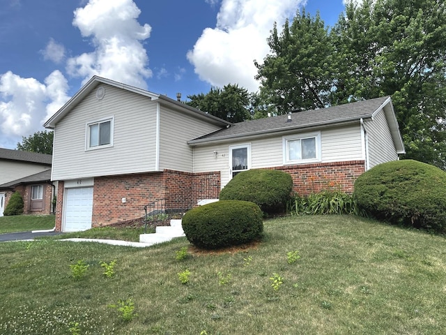 42 Pheasant Rd, Matteson, IL 60443 - tri-level home with brick siding, an attached garage, and a front yard