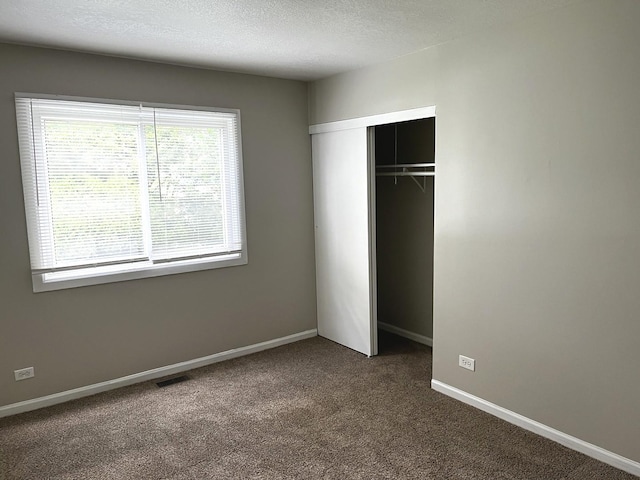 42 Pheasant Rd, Matteson, IL 60443 - unfurnished bedroom with carpet, a closet, and a textured ceiling
