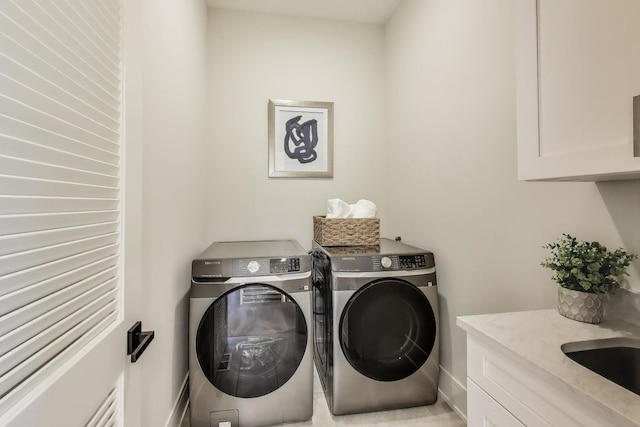 2611 W Carmen Ave, Chicago, IL 60625 - laundry area featuring cabinet space and washing machine and clothes dryer