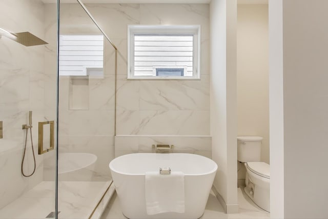 2611 W Carmen Ave, Chicago, IL 60625 - full bath featuring a freestanding bath, a marble finish shower, and tile walls