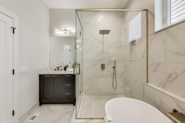 2611 W Carmen Ave, Chicago, IL 60625 - full bathroom featuring vanity, a marble finish shower, a freestanding bath, and marble finish floors