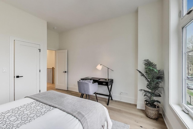 2611 W Carmen Ave, Chicago, IL 60625 - bedroom featuring light wood finished floors and multiple windows
