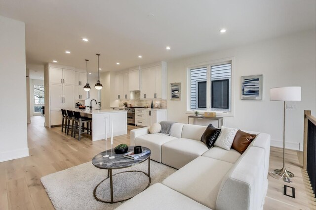 2611 W Carmen Ave, Chicago, IL 60625 - living room with light wood finished floors and recessed lighting