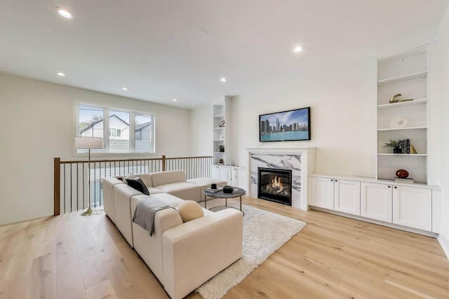 2611 W Carmen Ave, Chicago, IL 60625 - living area with light wood-type flooring, a premium fireplace, recessed lighting, and built in features
