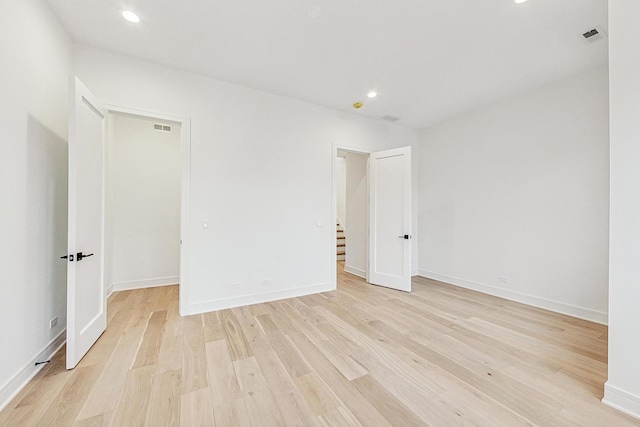 2607 W Carmen Ave, Chicago, IL 60625 - unfurnished room with light wood-type flooring, stairs, and recessed lighting