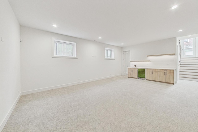 2607 W Carmen Ave, Chicago, IL 60625 - below grade area with light colored carpet, beverage cooler, and recessed lighting