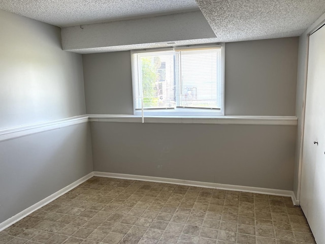 22526 Clarendon Ave, Richton Park, IL 60471 - unfurnished room featuring a textured ceiling and baseboards