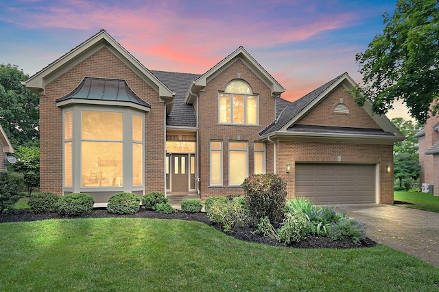 1521 Pendelton Ct, Palatine, IL 60067 - traditional-style home with concrete driveway, a yard, brick siding, and an attached garage
