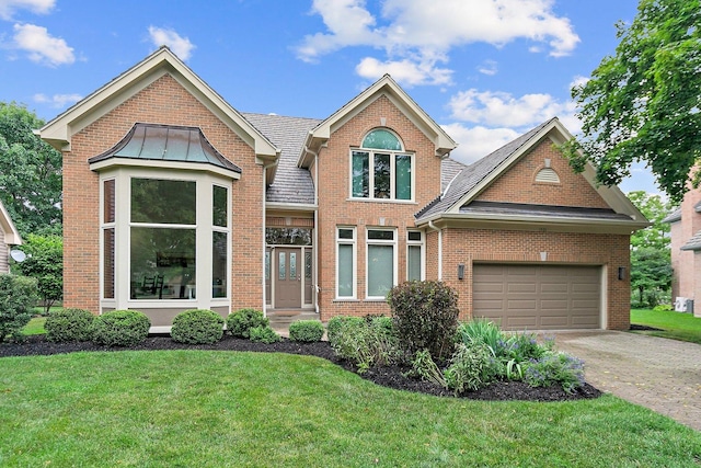 1521 Pendelton Ct, Palatine, IL 60067 - traditional-style home with brick siding, a front yard, an attached garage, driveway, and a standing seam roof