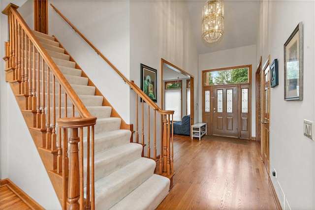 1521 Pendelton Ct, Palatine, IL 60067 - foyer with wood finished floors, stairs, a high ceiling, and a chandelier