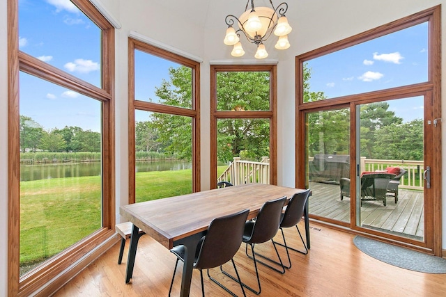 1521 Pendelton Ct, Palatine, IL 60067 - dining space featuring a water view, light wood-style flooring, a chandelier, and view of scattered trees