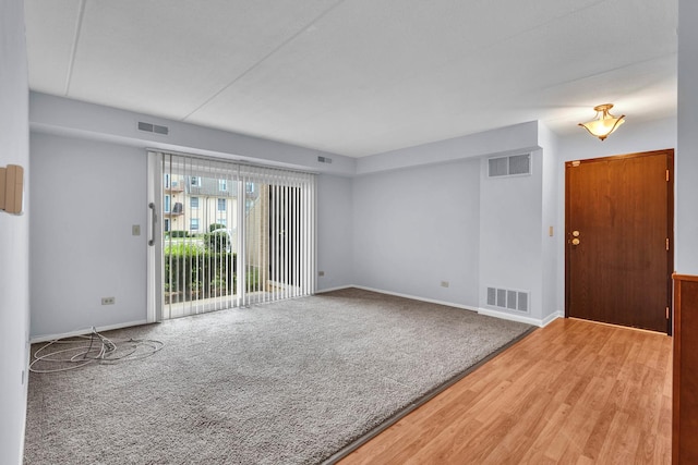 814 N River Rd Unit 1D, Mount Prospect, IL 60056 - carpeted spare room featuring wood finished floors and baseboards