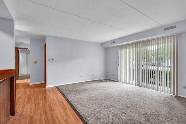 814 N River Rd Unit 1D, Mount Prospect, IL 60056 - unfurnished room with light wood-type flooring and baseboards