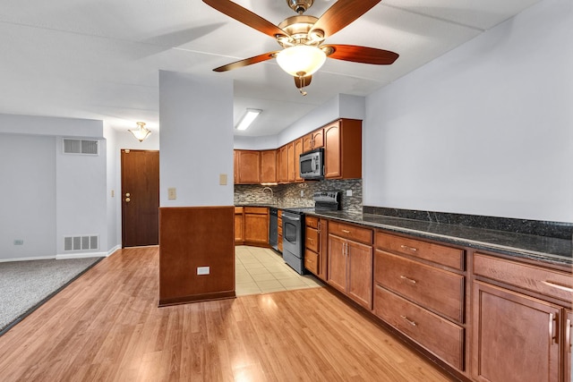 814 N River Rd Unit 1D, Mount Prospect, IL 60056 - kitchen with stainless steel appliances, light wood-style flooring, a ceiling fan, tasteful backsplash, and brown cabinets