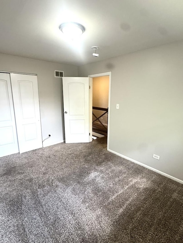 706 Carnation Ln, Matteson, IL 60443 - unfurnished bedroom featuring carpet flooring and a closet