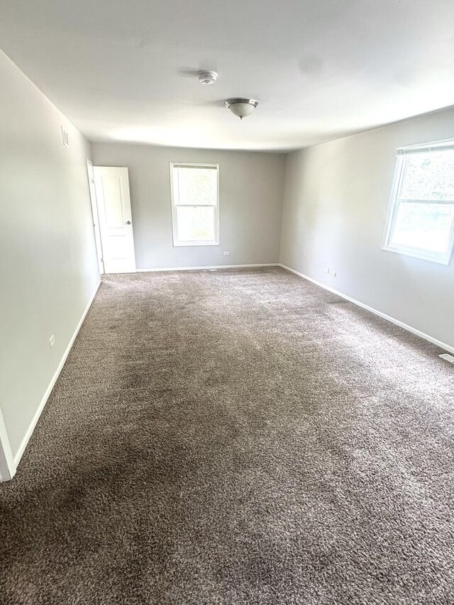 706 Carnation Ln, Matteson, IL 60443 - spare room with carpet and a smoke detector