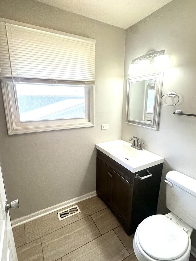 706 Carnation Ln, Matteson, IL 60443 - half bath with vanity and wood tiled floors