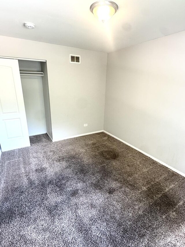 706 Carnation Ln, Matteson, IL 60443 - unfurnished bedroom with carpet and a closet