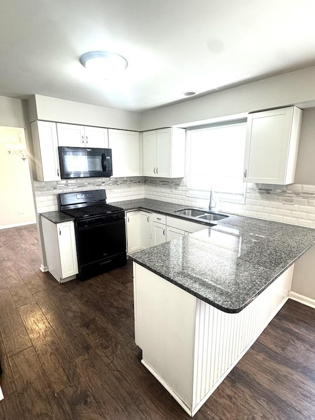 706 Carnation Ln, Matteson, IL 60443 - kitchen with black appliances, dark wood-style floors, white cabinets, a peninsula, and decorative backsplash