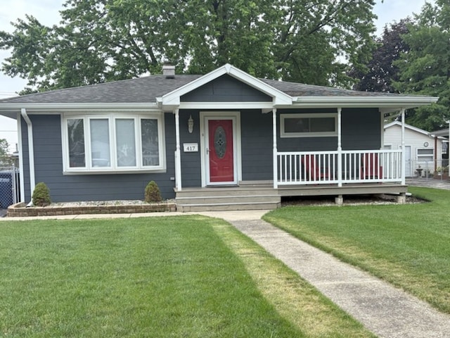 417 Major Dr, Northlake, IL 60164 - view of front facade with a front lawn, a chimney, a porch, and a shingled roof