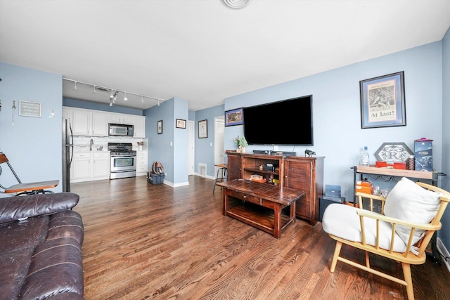 3848 25th Ave Unit 5, Schiller Park, IL 60176 - living area with wood finished floors and track lighting