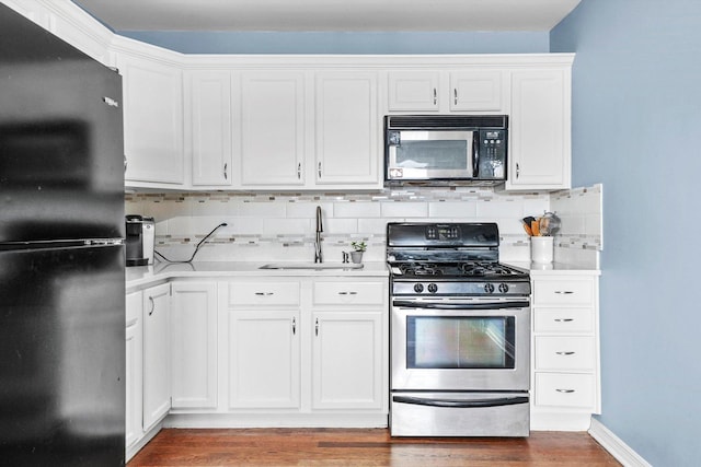 3848 25th Ave Unit 5, Schiller Park, IL 60176 - kitchen featuring freestanding refrigerator, gas stove, light countertops, and wood finished floors