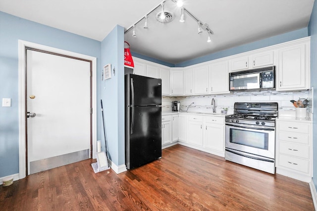 3848 25th Ave Unit 5, Schiller Park, IL 60176 - kitchen featuring gas stove, freestanding refrigerator, light countertops, and white cabinetry