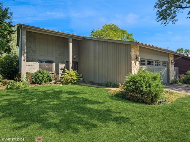 68 E Garden Ave, Palatine, IL 60067 - view of front facade featuring an attached garage, a front lawn, stone siding, and concrete driveway
