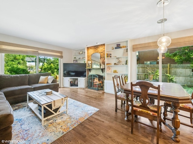 68 E Garden Ave, Palatine, IL 60067 - living area featuring wood finished floors, a fireplace, and built in shelves