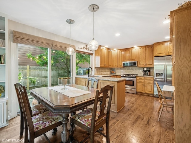 68 E Garden Ave, Palatine, IL 60067 - kitchen with stainless steel appliances, light wood-type flooring, tasteful backsplash, pendant lighting, and recessed lighting