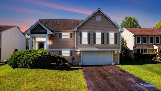 554 Foxford Rd, Bartlett, IL 60103 - view of front of house with asphalt driveway, an attached garage, and a yard