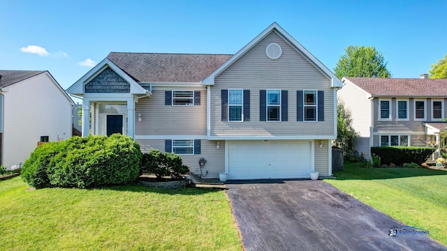 554 Foxford Rd, Bartlett, IL 60103 - view of front of home with asphalt driveway, an attached garage, and a front yard