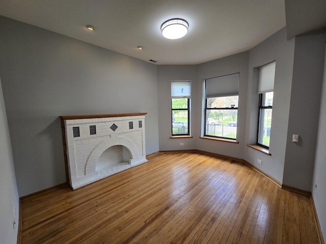 6137 S Kimbark Ave Unit 1, Chicago, IL 60637 - unfurnished living room featuring hardwood / wood-style floors and a fireplace