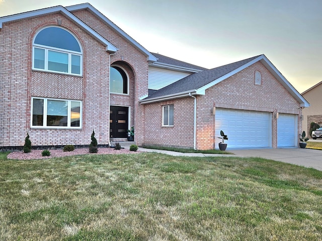 21206 Sophia Dr, Matteson, IL 60443 - traditional-style home with an attached garage, brick siding, concrete driveway, and a front yard