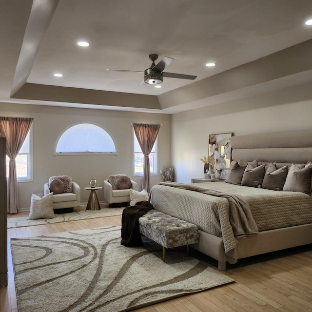 21206 Sophia Dr, Matteson, IL 60443 - bedroom featuring a raised ceiling, hardwood / wood-style flooring, multiple windows, recessed lighting, and ceiling fan