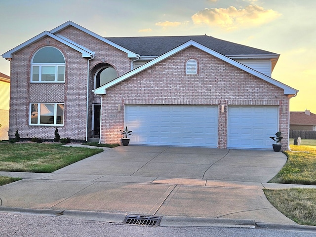21206 Sophia Dr, Matteson, IL 60443 - traditional-style house with concrete driveway, a garage, brick siding, and a front lawn