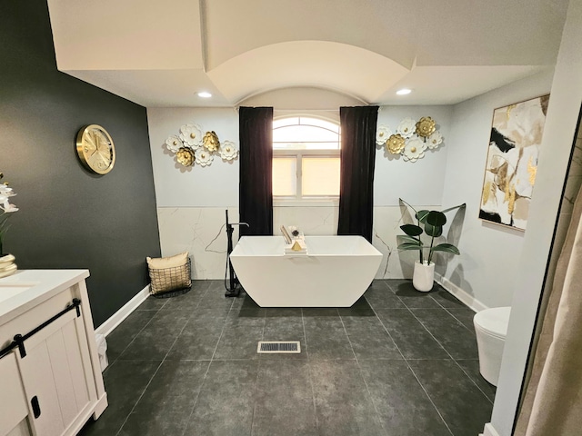 21206 Sophia Dr, Matteson, IL 60443 - bathroom with vanity, a freestanding bath, tile patterned floors, and recessed lighting