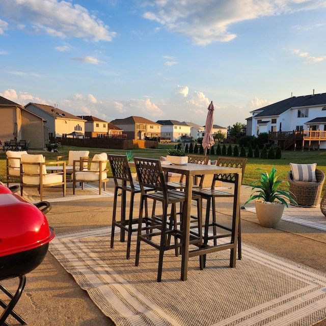 21206 Sophia Dr, Matteson, IL 60443 - wooden deck with a residential view, outdoor dining space, a lawn, and a patio