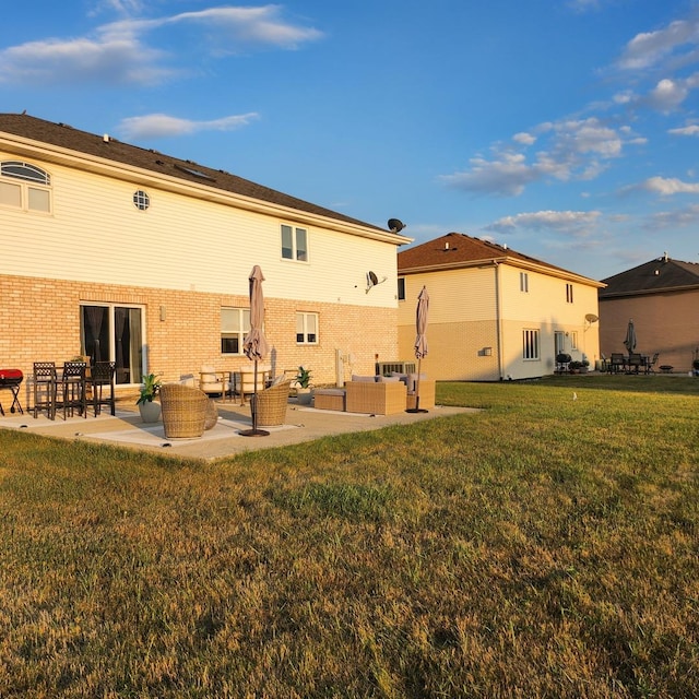 21206 Sophia Dr, Matteson, IL 60443 - back of property featuring outdoor lounge area, a patio, a lawn, and brick siding