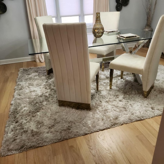 21206 Sophia Dr, Matteson, IL 60443 - dining space featuring wood finished floors and radiator