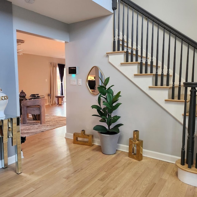 21206 Sophia Dr, Matteson, IL 60443 - stairs featuring wood finished floors