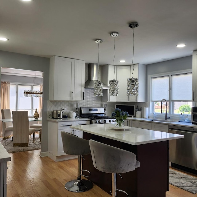 21206 Sophia Dr, Matteson, IL 60443 - kitchen with wall chimney range hood, stainless steel appliances, backsplash, healthy amount of natural light, and recessed lighting