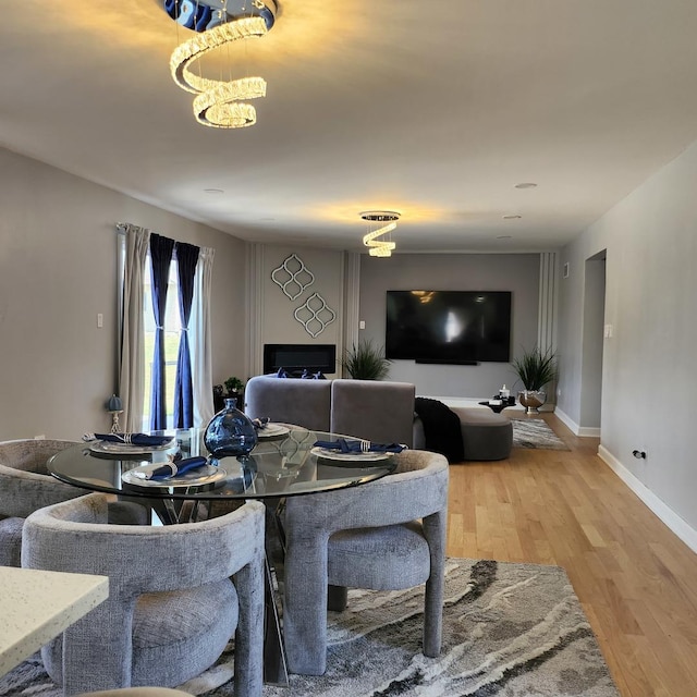 21206 Sophia Dr, Matteson, IL 60443 - living area with light wood-style flooring and a chandelier